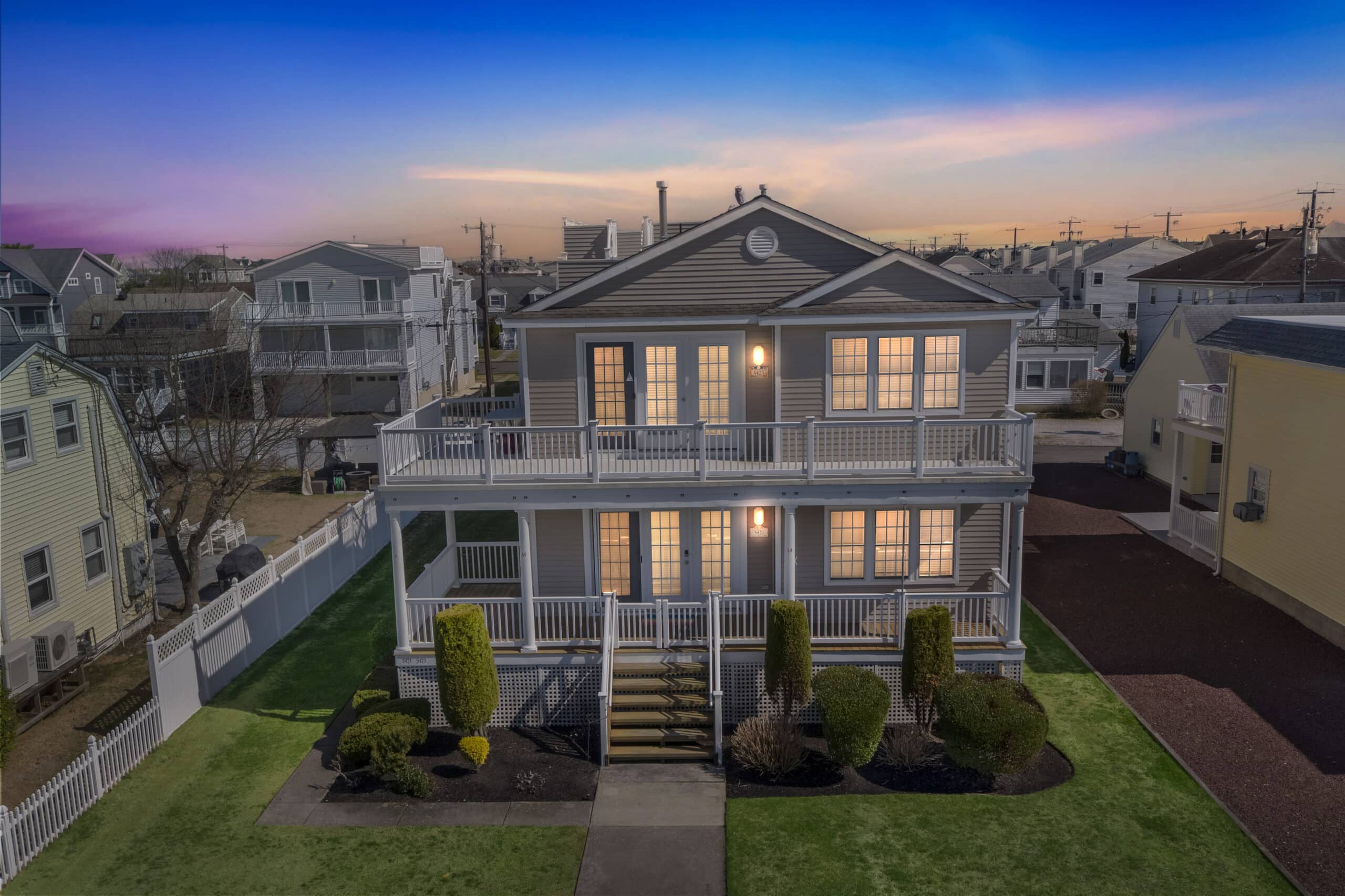 Dusk aerial drone photograph of a South Jersey Shore waterfront home