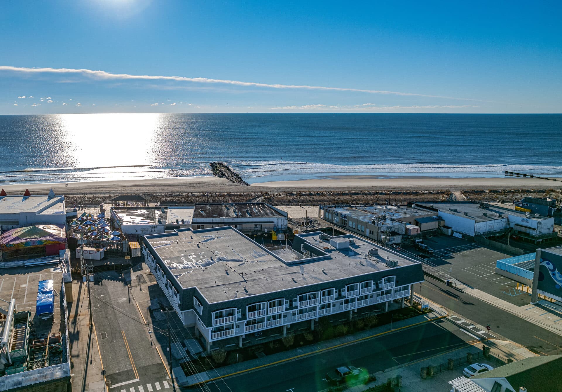 Aerial view of Beach Watch Condominium on the boardwalk in Ocean City NJ, at 7th Street and the beach