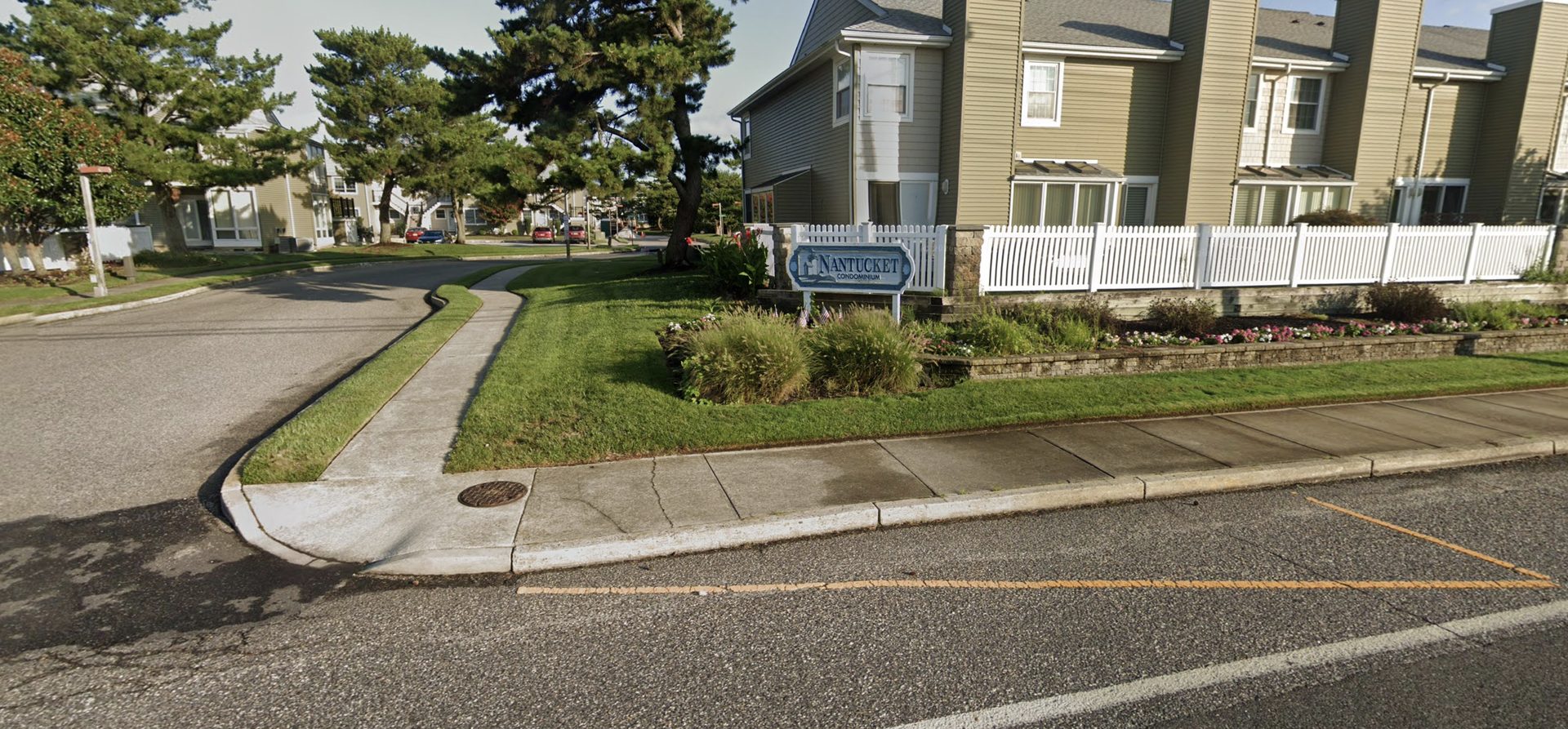 Nantucket Condominium entrance sign and townhomes in Ocean City, NJ