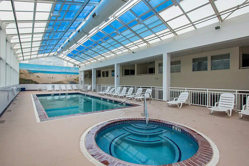 Indoor pool and hot tub with beach mural at Watson's Regency, Ocean City NJ