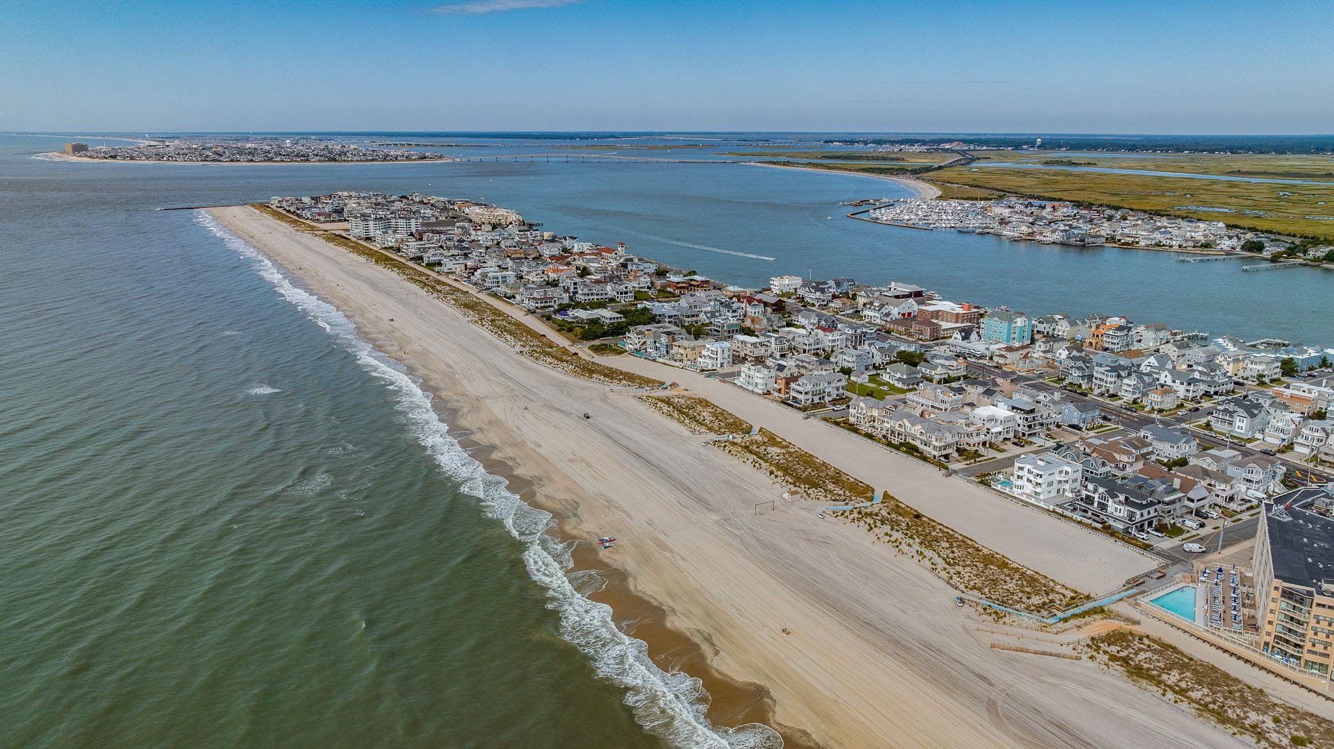 Aerial view down Longport, NJ toward the southern tip of the island, with the ocean on one side and the bay on the other